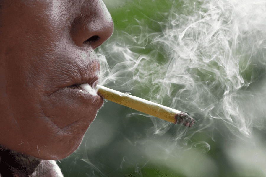 A man smoking native tobacco